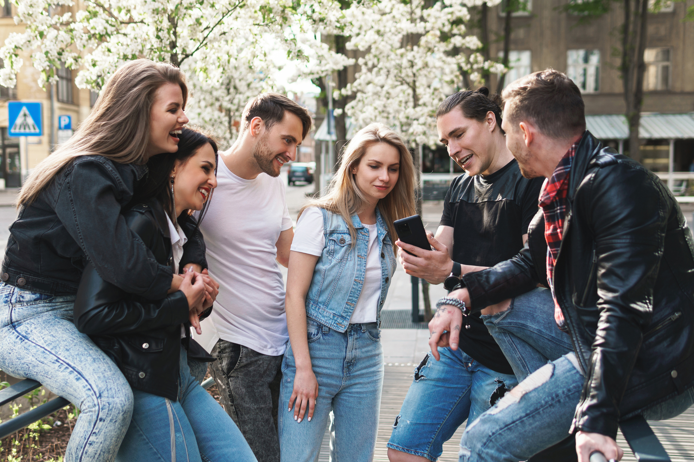 Group of best friends are having fun on a street